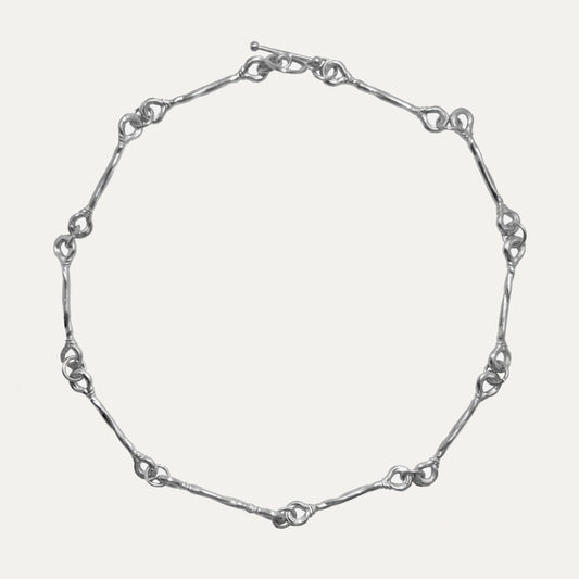 A recycled sterling silver choker necklace with adjustable length.
