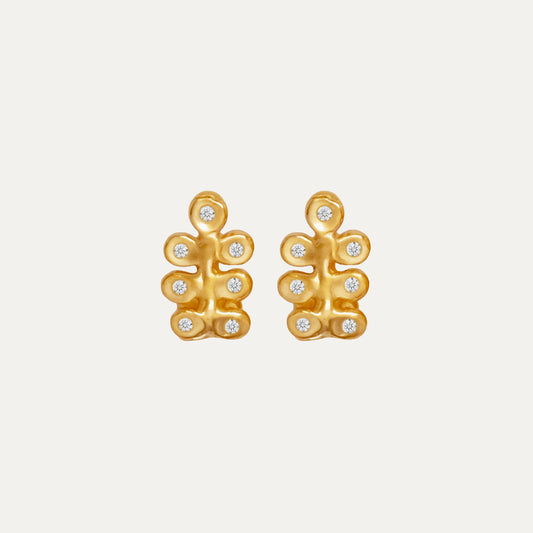 A pair of gold earrings featuring an organic design with small gemstones.