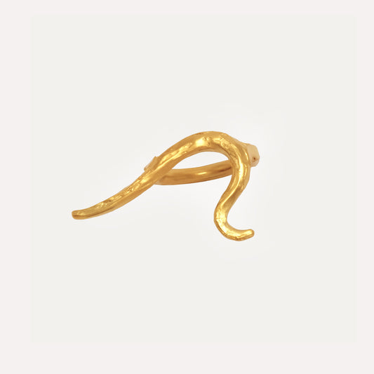 A gold vermeil ring with a textured, organic shape, crafted from recycled sterling silver.